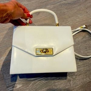 White purse from France. Has optional shoulder strap